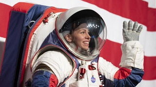 Kristine Davis, a spacesuit engineer at NASA’s Johnson Space Center, wearing a ground prototype of NASA’s new Exploration Extravehicular Mobility Unit (xEMU), is seen during a demonstration of the suit, Tuesday, Oct. 15, 2019 at NASA Headquarters in Washington. The xEMU suit improves on the suits previous worn on the Moon during the Apollo era and those currently in use for spacewalks outside the International Space Station and will be worn by first woman and next man as they explore the Moon as part of the agency’s Artemis program.  Photo Credit: (NASA/Joel Kowsky)