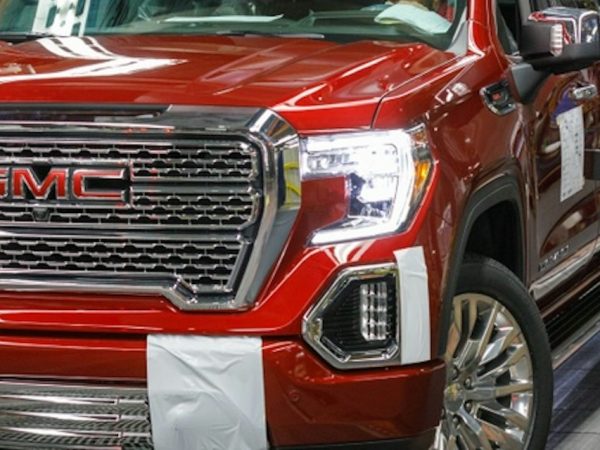 Wingspans story of Jim Endl who works at GM. Image of GMC pickup truck.